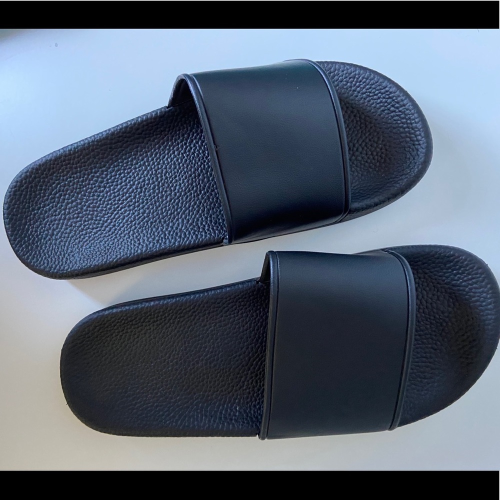 Black leather flip flops